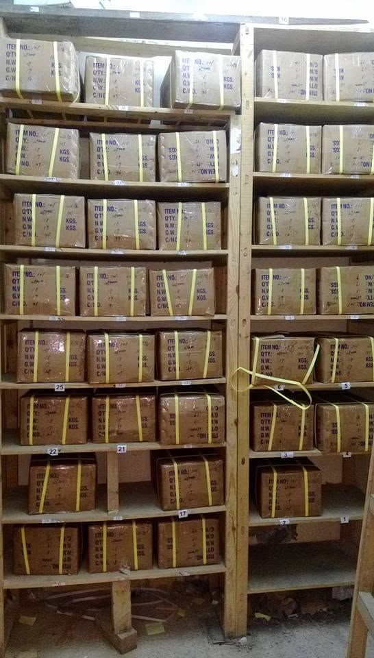 Warehouse shelving with labelled cartons of stock